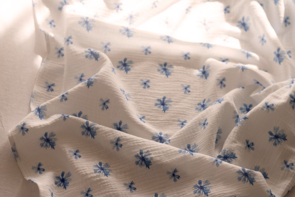 Cornflower muslin gathered in afternoon light