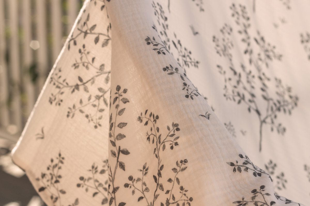 Snowberry muslin hanging on a sunlit verandah